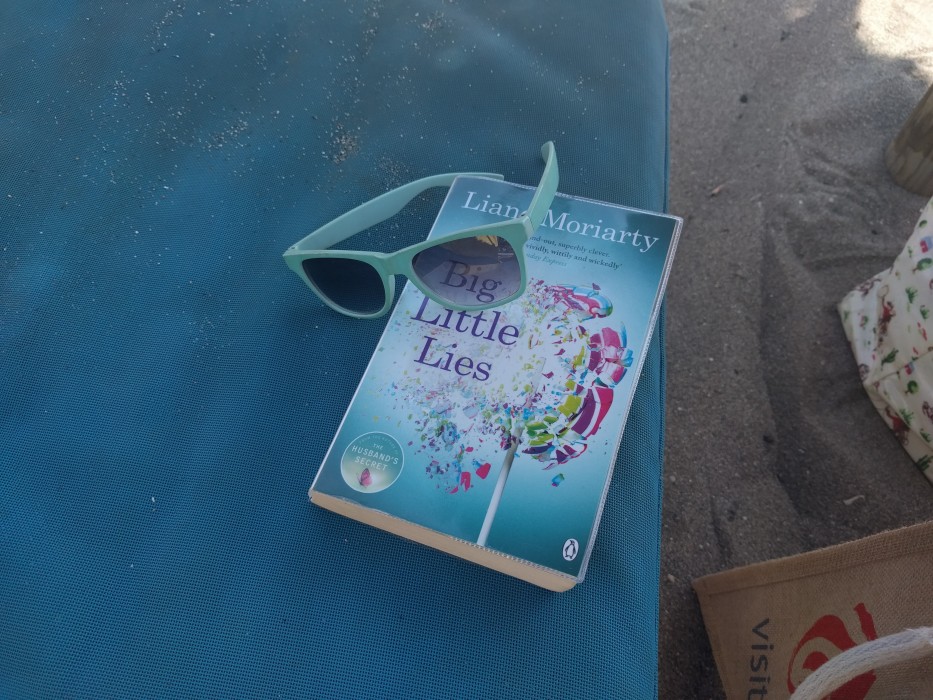 beach book with sunglasses